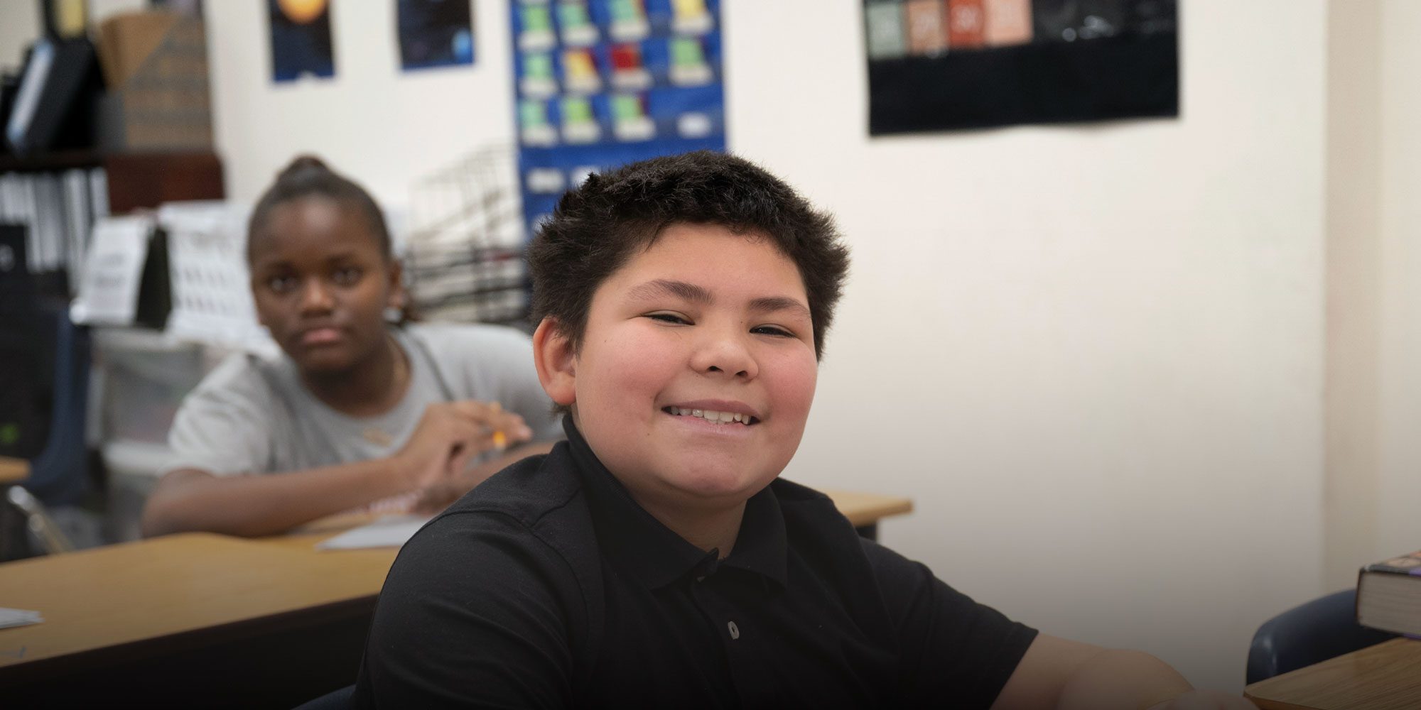 Smiling student working at desk