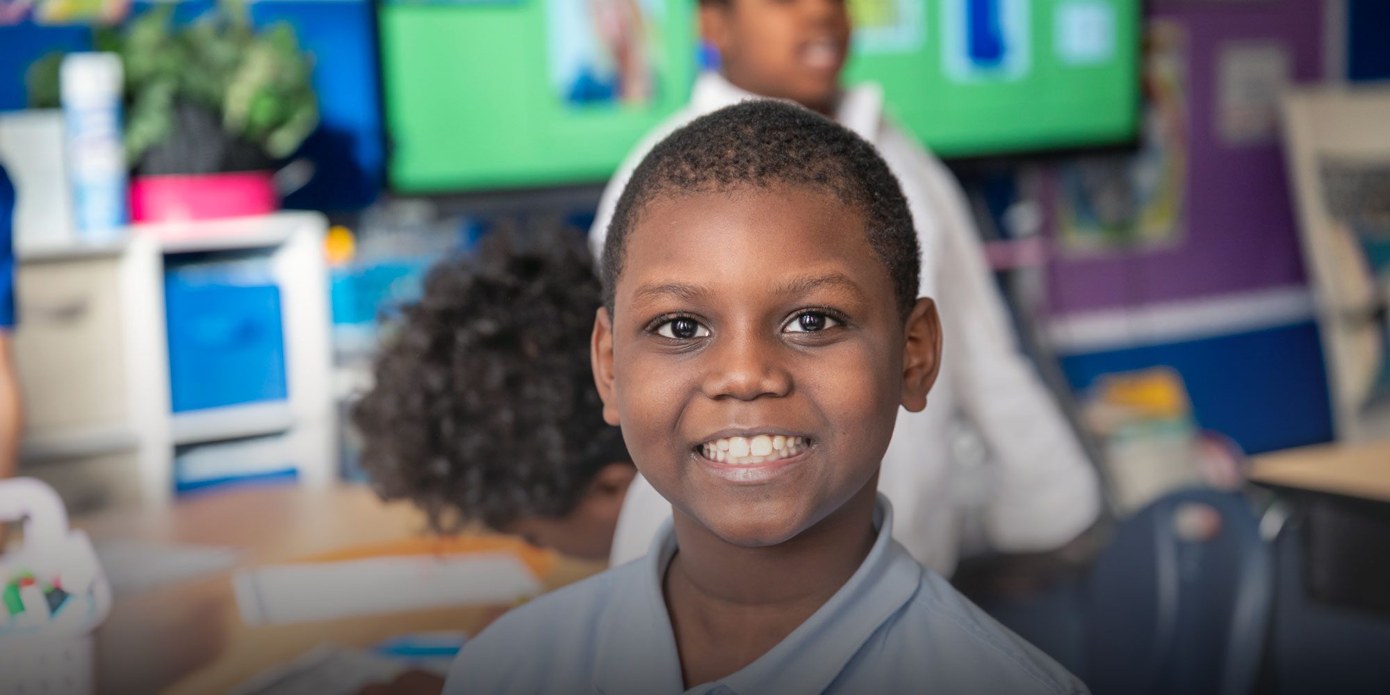 Smiling student at desk