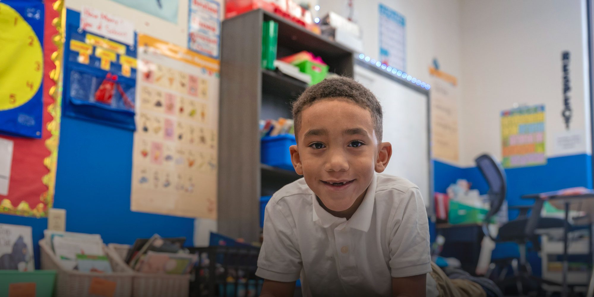 Smiling student reading